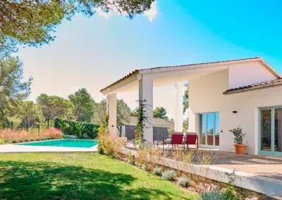 gay men-only pool terrace garden with forest and ocean views near Sitges