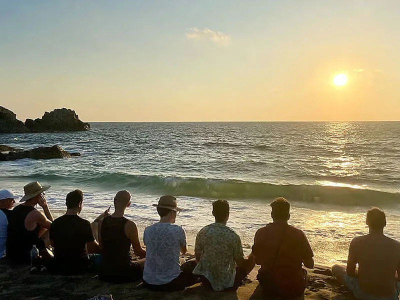 outdoor yoga session at gay men-only retreat near Sitges with forest and sea views