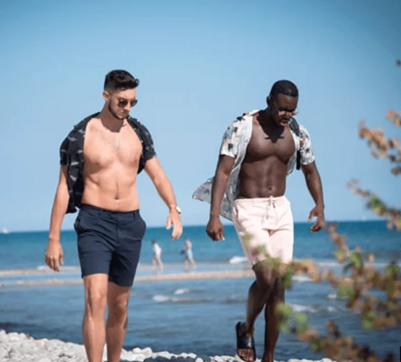 Gay men enjoying a beach day in Sitges