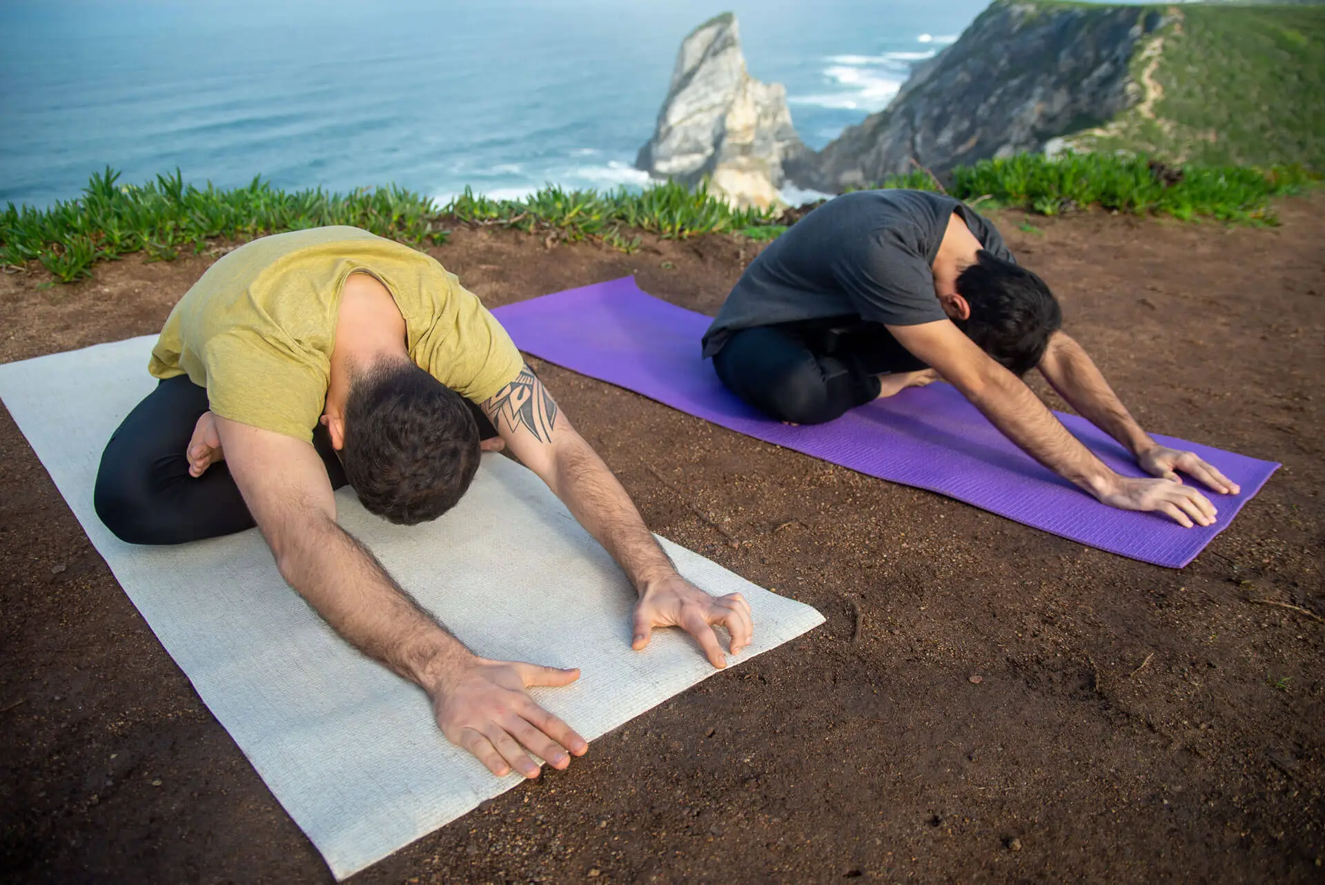 Gay men practising yoga together at a retreat near Sitges