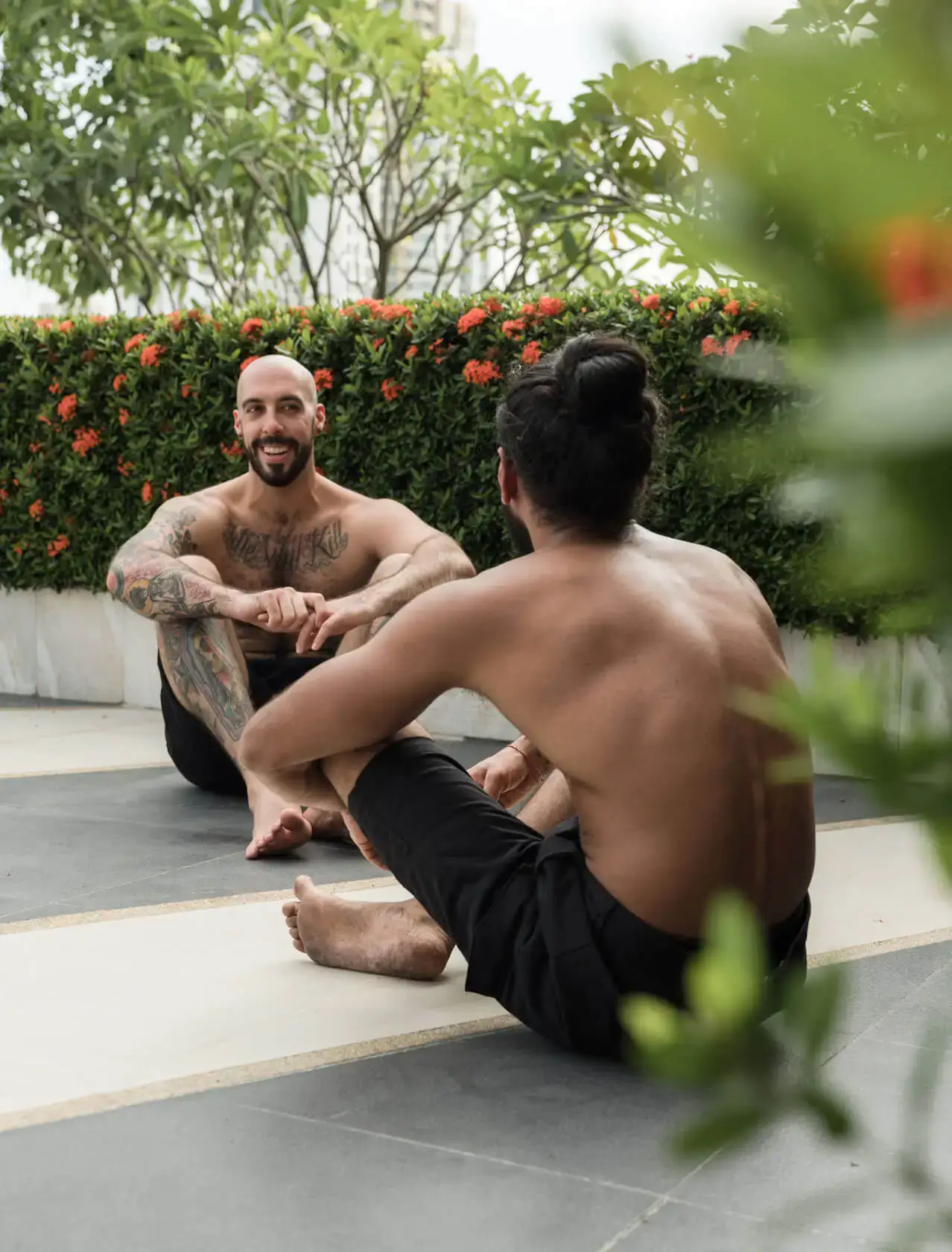 Gay men sharing a relaxed moment at a Tantra retreat near Sitges