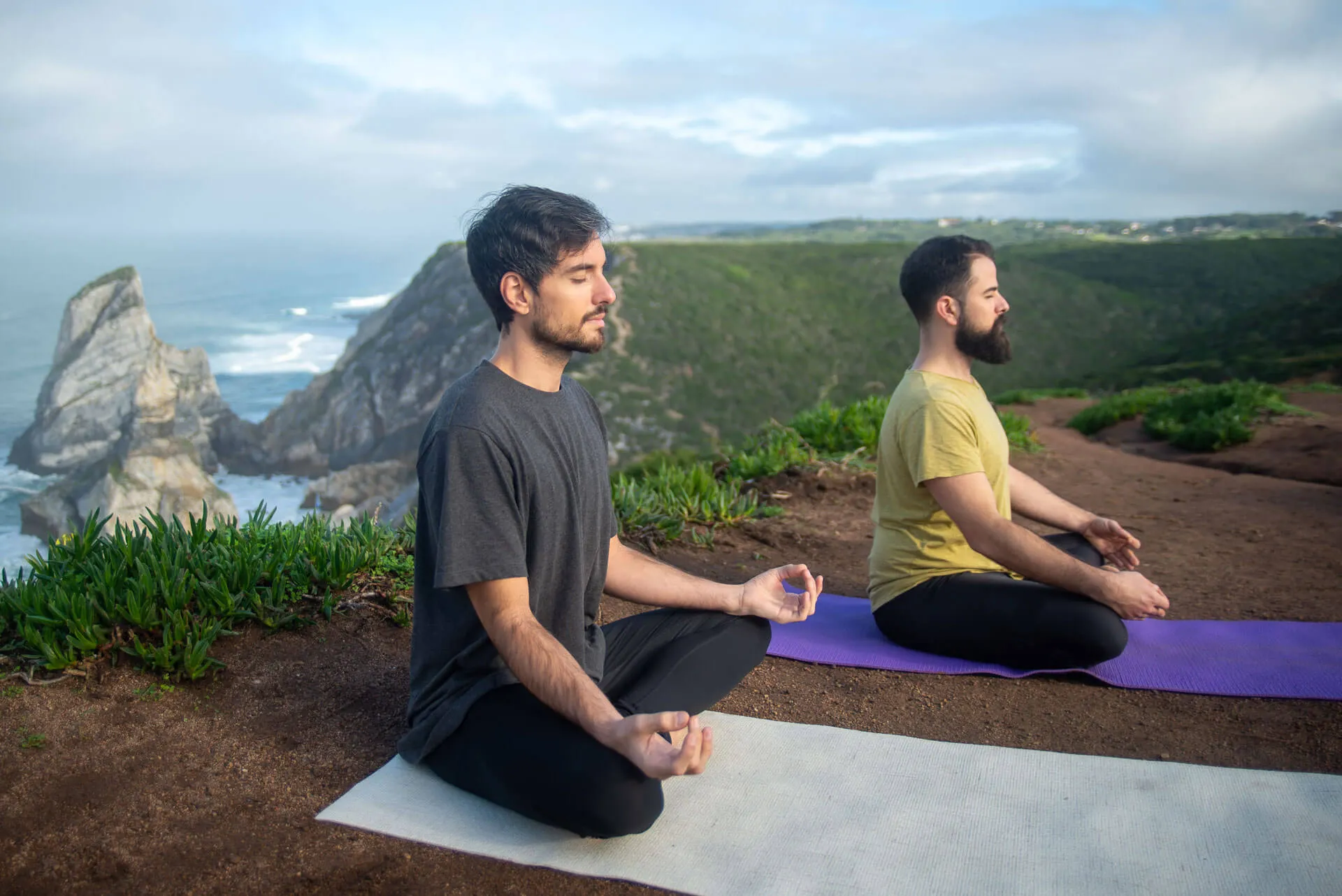 Adult men practicing mindful yoga in a calm wellness setting