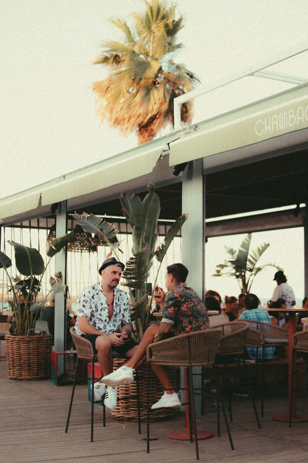 Gay men socialising on a bar terrace in Sitges