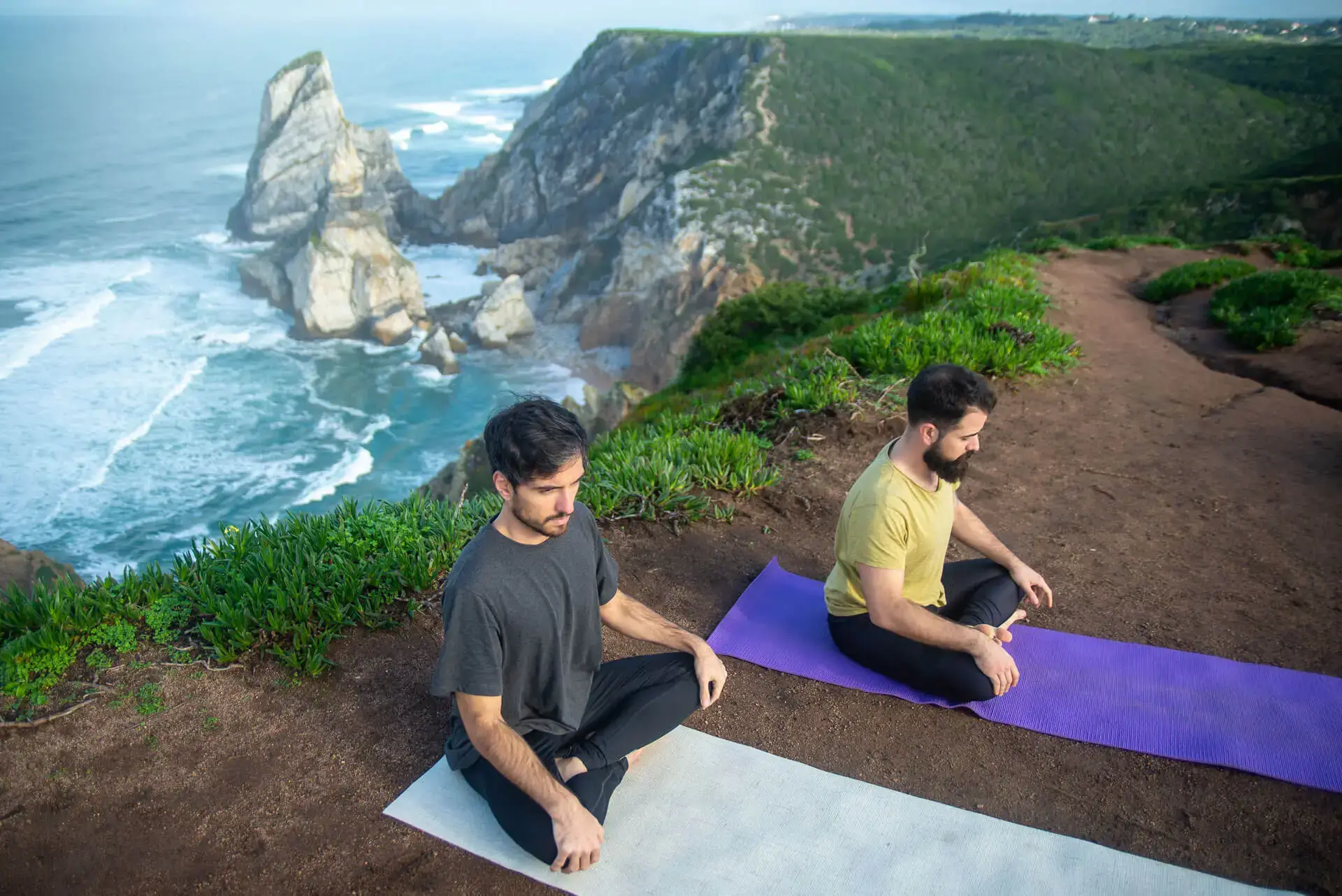 Men practising meditation and breathwork during a Tantra retreat